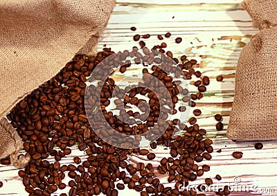 Ã Â Ã‚ÂÂ¡offee beans in a bag on a light wooden background, top view. Shy pastel background. Natural food Stock Photo